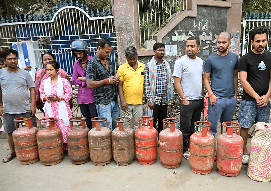 1773409290_img-LPG-Crisis people standing in line with LPG cylinders during gas shortage in India