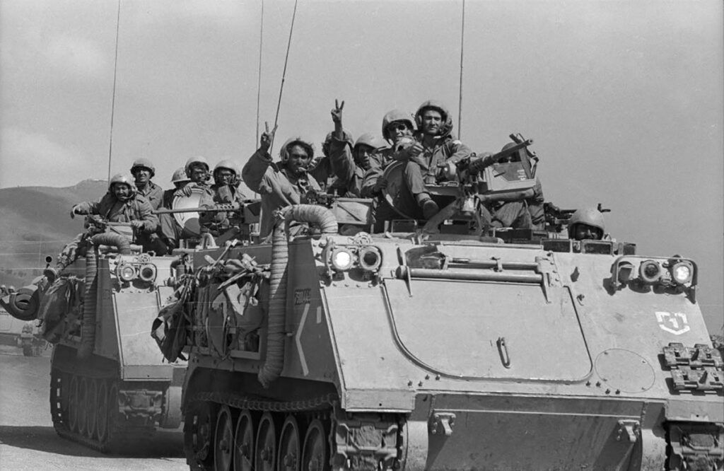 Israeli soldiers riding armored military vehicle during war historical image
israeli-troops-yom-kippur-war-1024x6662272887668561208647