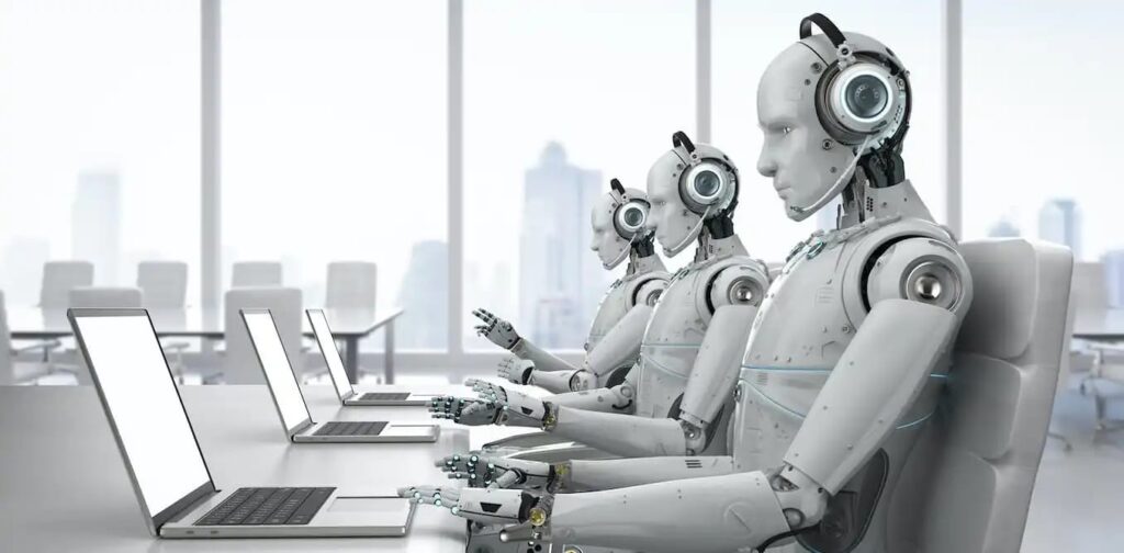 robots working on laptops replacing human jobs in office environment