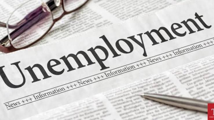 Unemployment headline in newspaper representing job loss crisis
